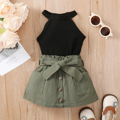 Baby girl wearing a ribbed halter top and matching short skirt
