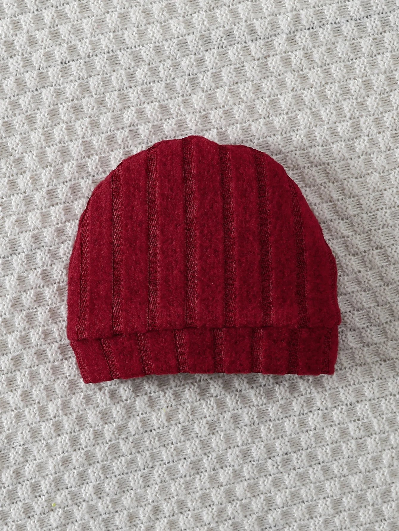 Different colour variation or layout view of the baby red bear badge winter onesie and hat set