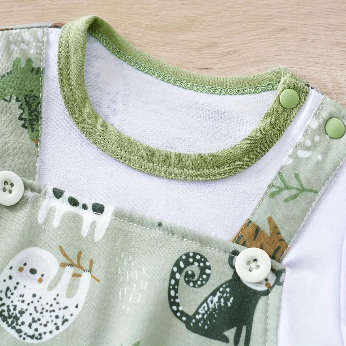 Styling option and alternate perspective of the baby boys zoo animal print short sleeve romper