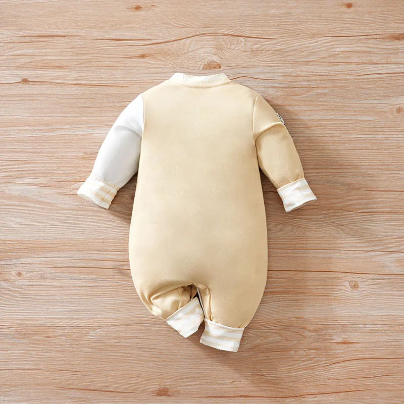 Detail view showing the fabric finish and pattern of the baby boys cartoon baseball jumpsuit