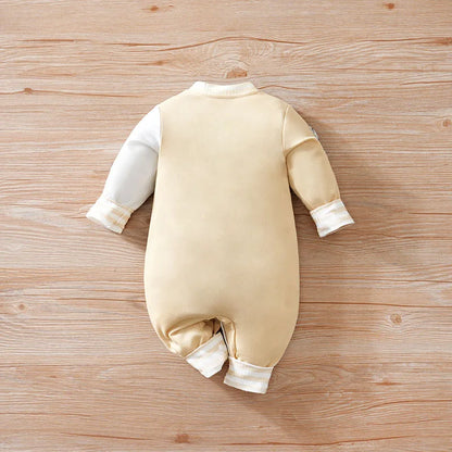 Detail view showing the fabric finish and pattern of the baby boys cartoon baseball jumpsuit