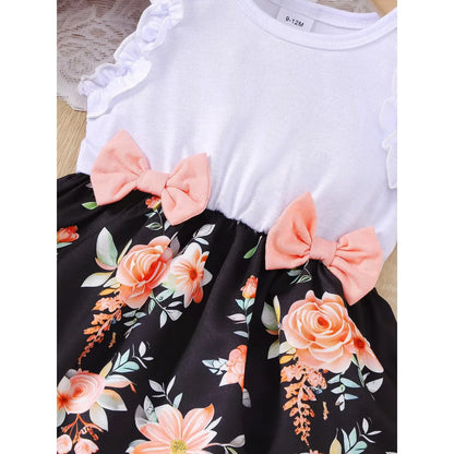 Baby girl wearing a sleeveless floral party dress with a bow