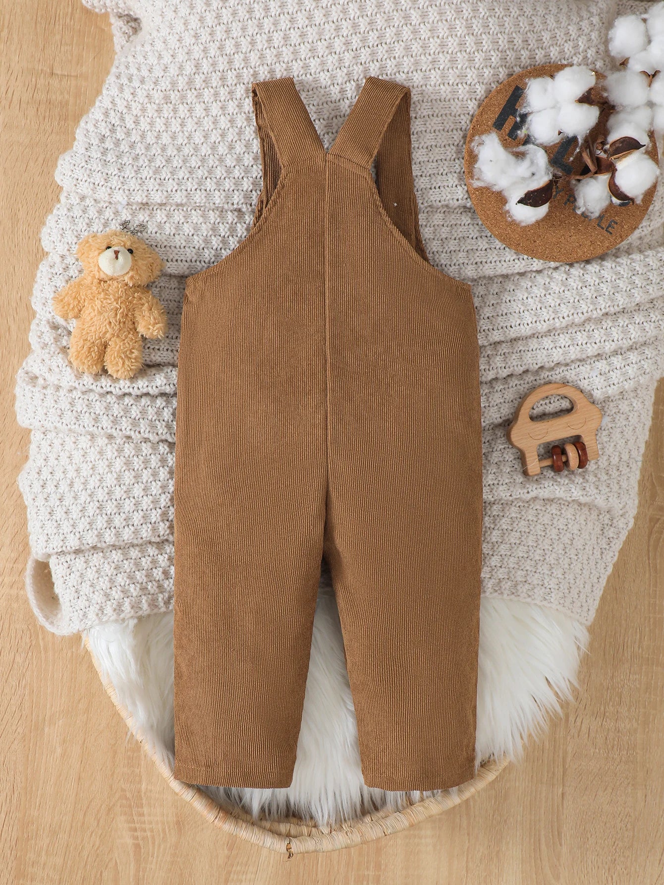 Adjustable waist detail on boys corduroy bear overalls