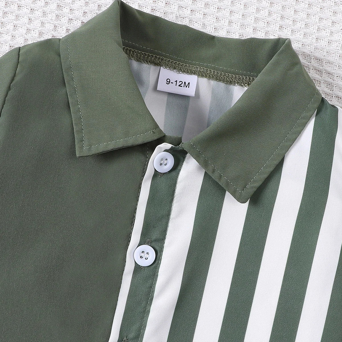 Styling option and alternate perspective of the baby boys colour block short sleeve shirt and shorts set
