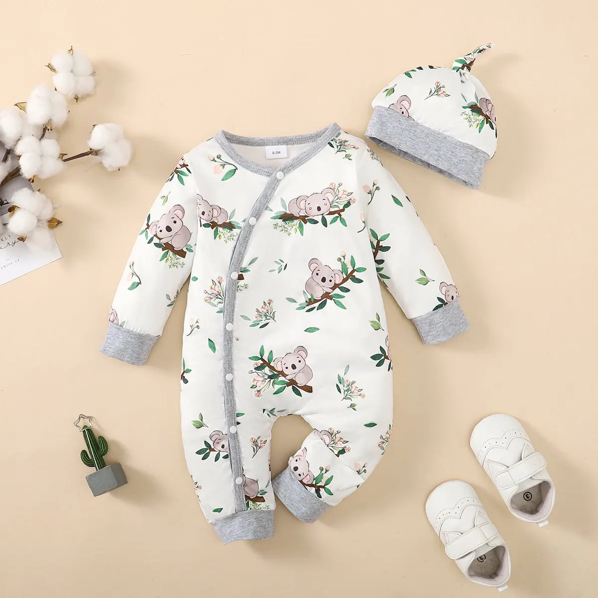 Button-up front detail on baby boys winter romper