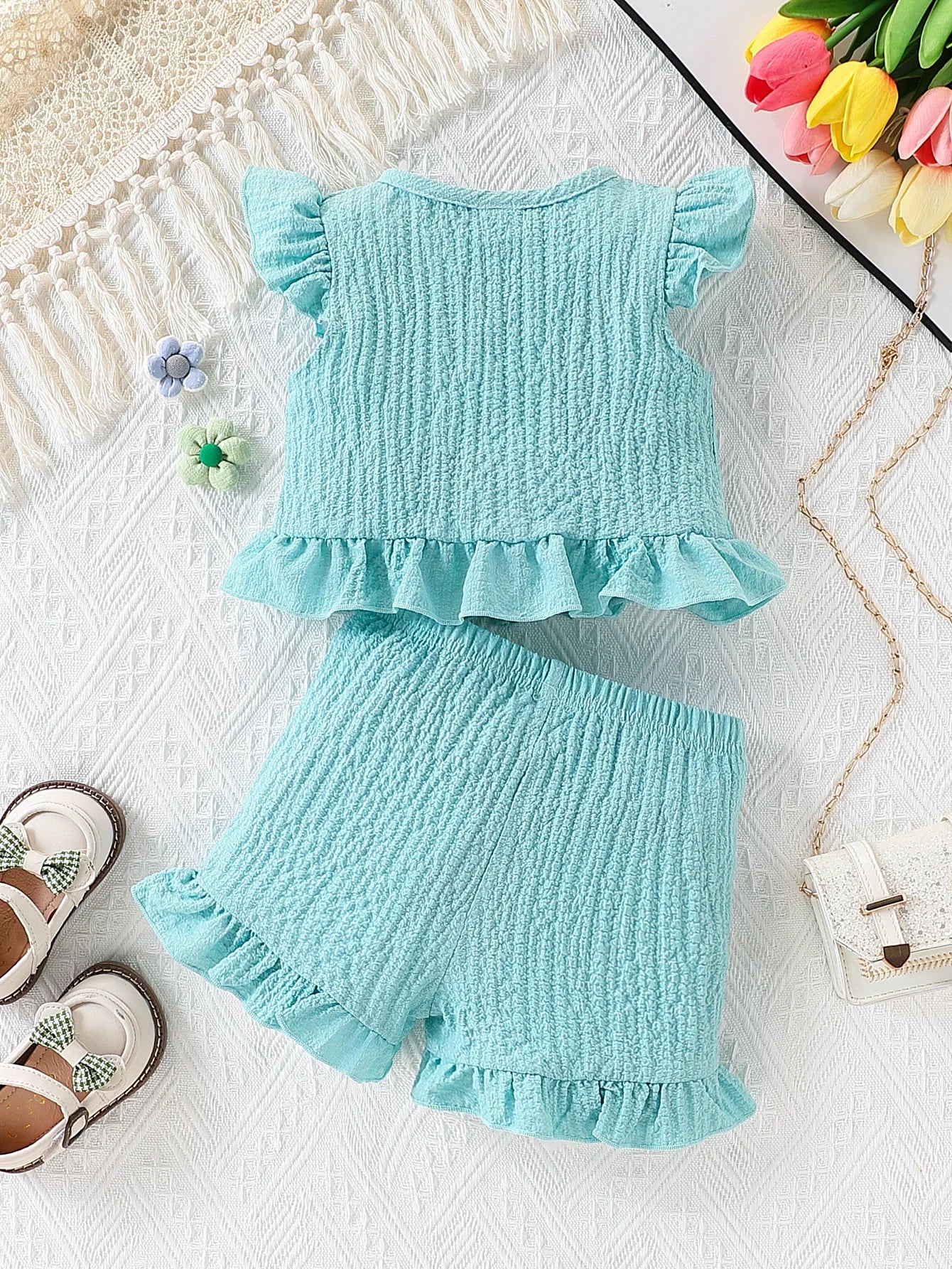Side view of baby girls fly sleeve top & shorts set