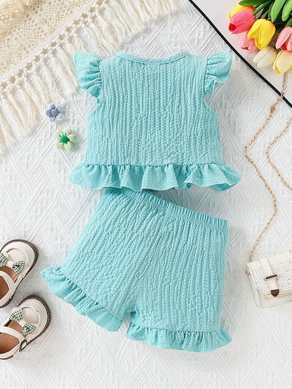 Side view of baby girls fly sleeve top & shorts set