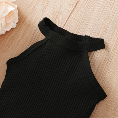 Baby girl wearing a ribbed halter top and matching short skirt