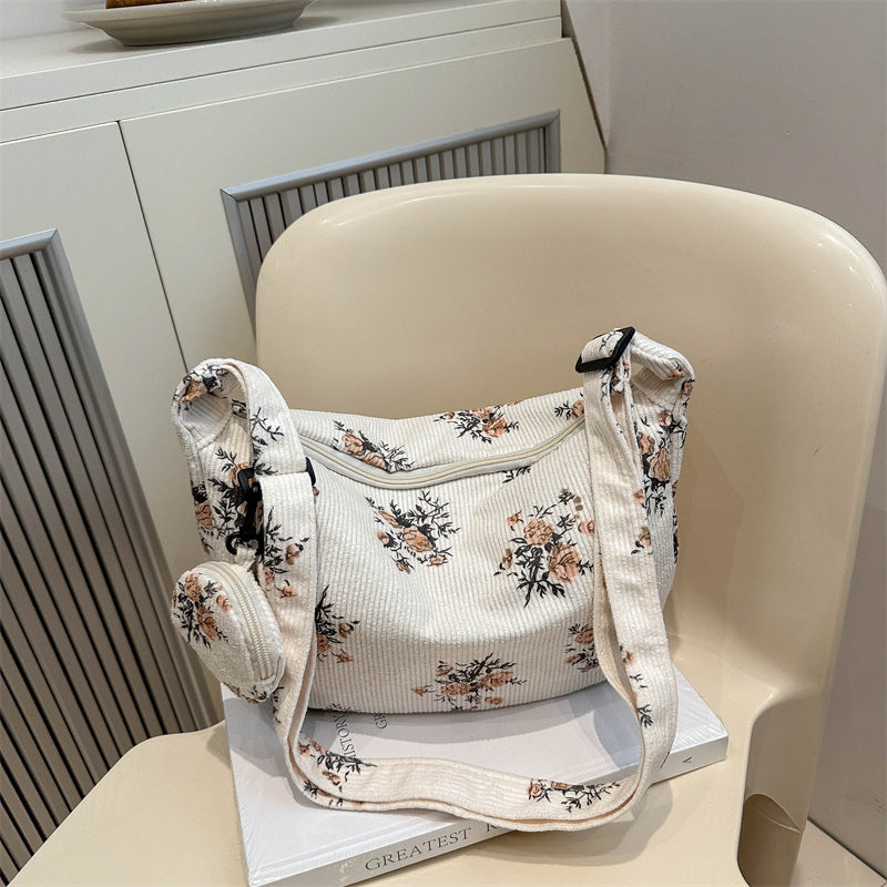 Soft women's messenger bag - dumpling bag with floral print, canvas, casual everyday use