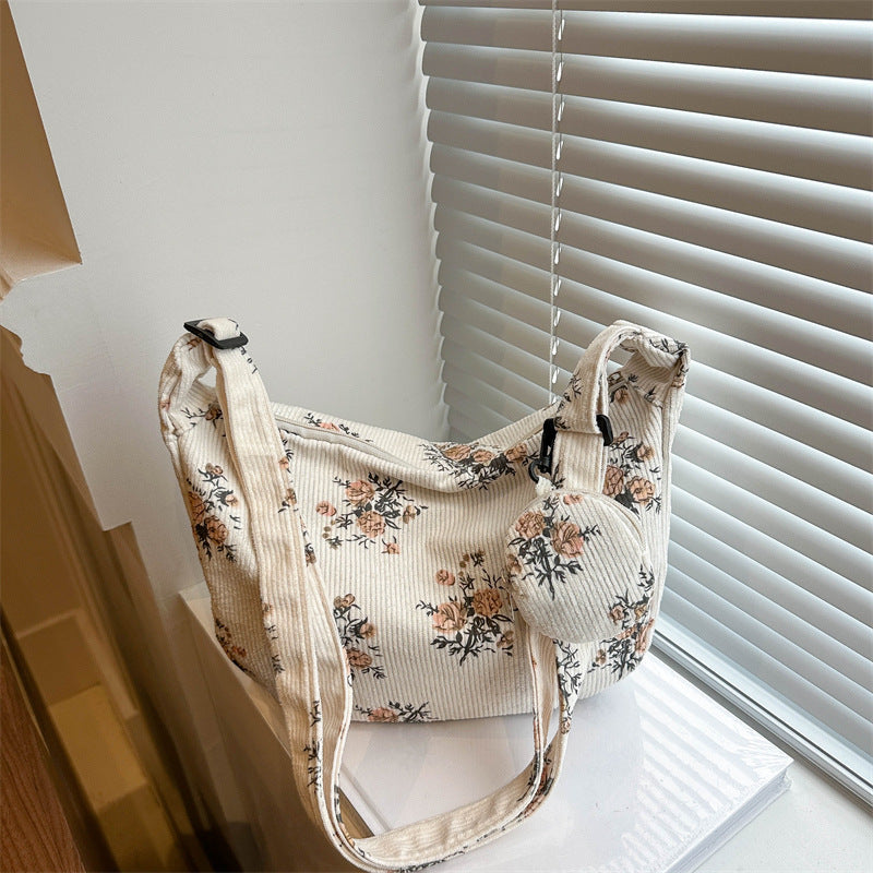 Soft women's messenger bag - dumpling bag with floral print, canvas, casual everyday use