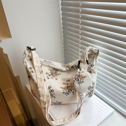 Soft women's messenger bag - dumpling bag with floral print, canvas, casual everyday use